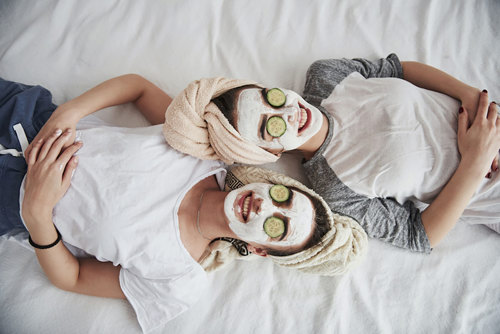 Twin sisters gettings facials.